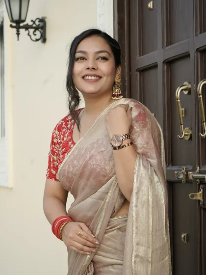 Another angle of the client, showing how the jhumkas complement her traditional look.