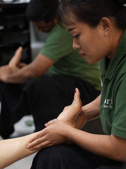 Another view of our foot massage service, showing the careful attention our therapist gives to every part of the foot to ensure maximum relaxation and relief.