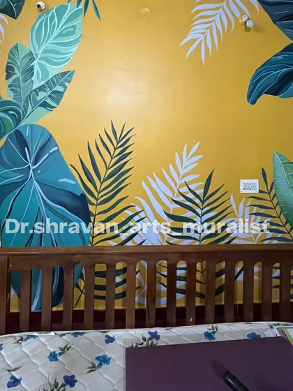 This tropical-themed wall painting with its bright yellow background gives off major Pondicherry vibes, making the bedroom feel sunny and cheerful.