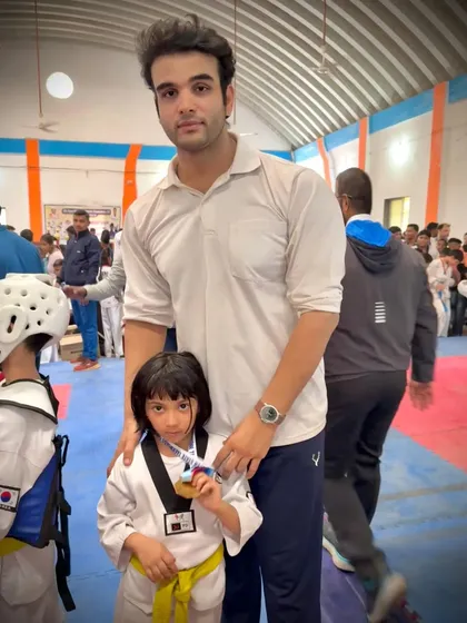 A young yellow belt proudly shows off her medal from the state championship. A fantastic achievement for one of our newer competitors.