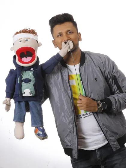 A studio photograph of me and Bunny. This clean, professional image showcases the tools of my trade: my voice and my puppet.