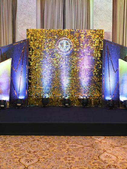 A direct, full view of the Gatsby stage. The combination of a sequin wall, spotlights, and geometric panels created a dynamic and glamorous focal point.
