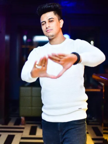 Making the triangle sign, a symbol of connection and energy. It's all about creating a unified vibe.
