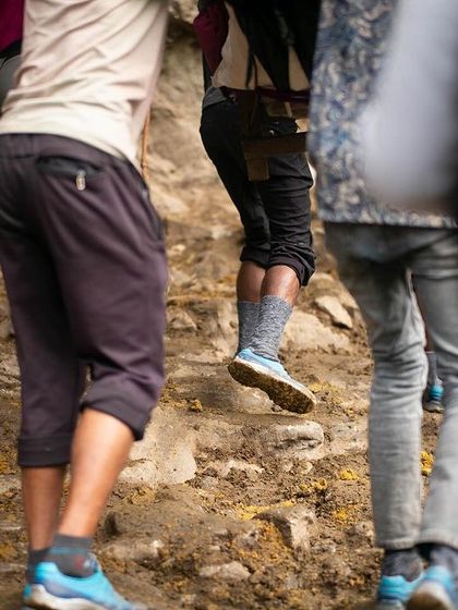The path is not always clear or easy. Much of our Himalayan treks involve navigating rough, unpaved trails, one step at a time. This image shows the reality of the climb, a physical effort that mirrors the inner work of the spiritual journey.