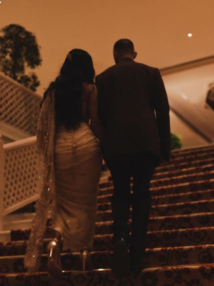 A dreamy, silhouetted shot that captures the romance and glamour of the evening. It’s a beautiful, artistic moment from the couture week event.