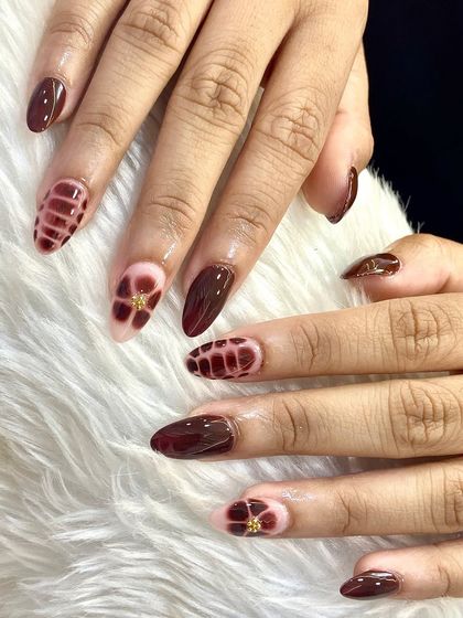 Another angle of the showstopping burgundy set, showing the full hand and the beautiful contrast of textures and patterns.
