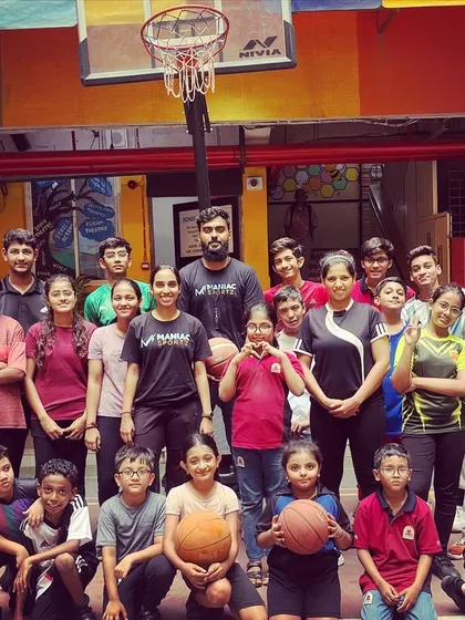 Building future champions, one dribble at a time. A group photo of our young ballers and coaches, representing the next generation of Maniacs.