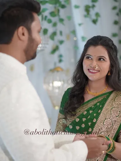 A candid look of love between the couple. The bride's natural makeup look ensures her genuine emotions are the focus.