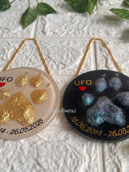 Another shot of the two memorial plaques together. Seeing them side-by-side shows how versatile art can be in expressing love and loss. Each one is a unique tribute.