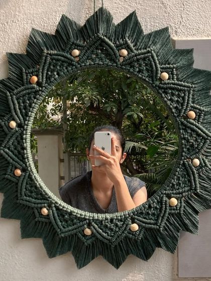 This 24-inch dark green macrame mirror with wooden beads was a custom birthday gift. We were so happy to hear that the client's best friend loved her unique, handmade present.