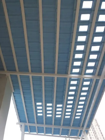 For this project, we created a unique Santorini-themed pergola with a blue roof and square cutouts. It lets in beautiful patterns of light while providing shade and a pop of color.
