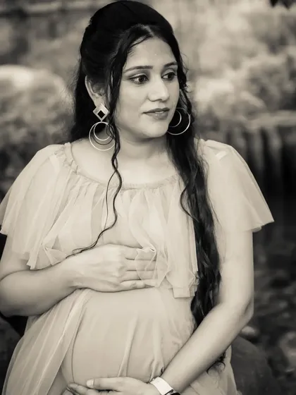 A thoughtful and elegant black and white portrait of the mom-to-be. The classic style gives the photo a timeless, cinematic quality.