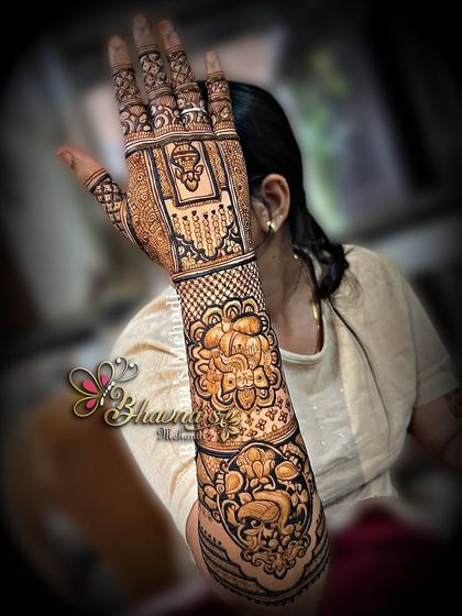 An elegant back-hand design with Ganpati figures, created by a student during our wedding season workshop. This is the kind of detailed work our artists learn to master.