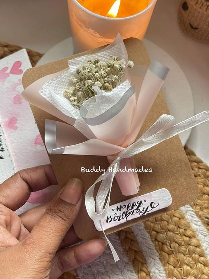 This birthday hamper includes a super cute mini bouquet made with dried baby's breath, attached to a custom "Happy Birthday" card.