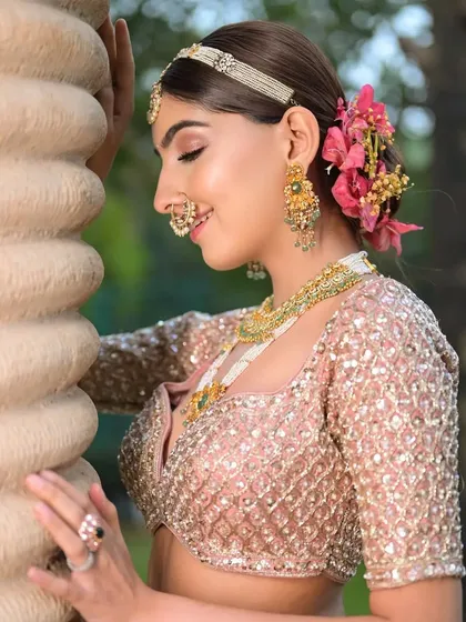 A side profile showing how the floral arrangement is integrated into the bun, creating a soft and natural look.