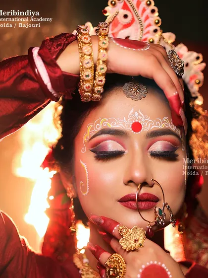 A close-up of the traditional Bengali bridal makeup. Our courses cover regional bridal looks, focusing on details like the Chandan art, bold eyes, and flawless base.