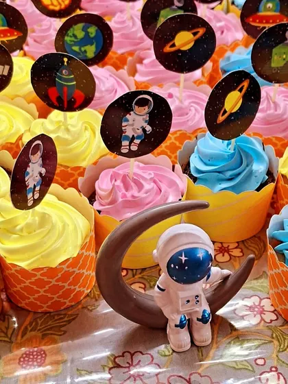 For a child's birthday party, I created this fun batch of space-themed cupcakes. Each one is a soft, eggless vanilla or chocolate cupcake with colorful frosting, topped with edible astronauts, planets, and rockets to create a little galaxy of treats.