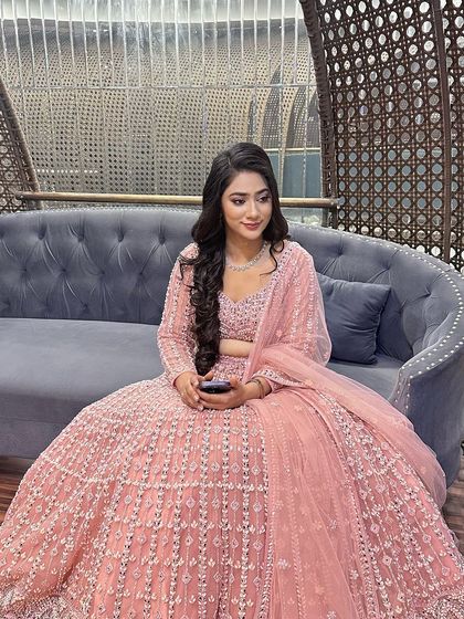 A candid moment capturing the elegance of the overall look.