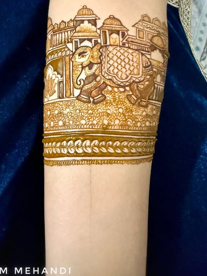 The elephant procession armband with more detail and shading added. The fine lines and patterns create a rich and textured look.