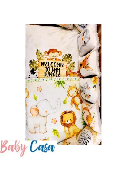 "Welcome to my Jungle." This fun and vibrant bedding set is perfect for a little explorer, featuring a quilt and pillows with adorable printed safari animals like elephants, lions, and monkeys.