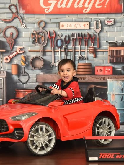 A big smile from behind the wheel. The joy on his face is what makes this car garage theme one of my favorites.