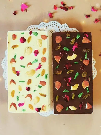 A sneak peek of our Shahi Gulkand and Almond Scotch chocolate bars. We use high quality ingredients and beautiful toppings like dried rose petals and nuts to create these festive delights.