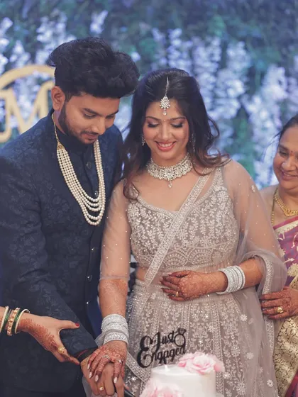 The cake cutting moment at their engagement. I had the pleasure of doing the subtle glam makeup and hair for both the bride and the groom.