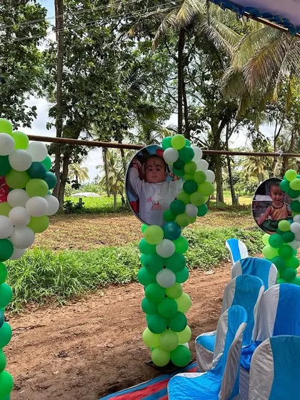 Simple and charming outdoor decor for a party in a rustic setting. I used balloon pillars with the birthday girl's photos to line the guest seating area.