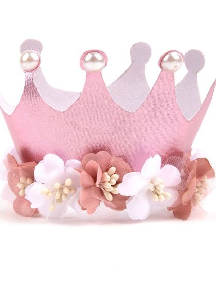 A detailed shot of the pink floral first birthday crown accessory.