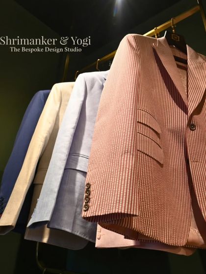 A closer look at our pastel and striped blazers. The angle highlights the texture of the fabrics and the clean cut of the lapels, showcasing options for both subtle and distinct styles.