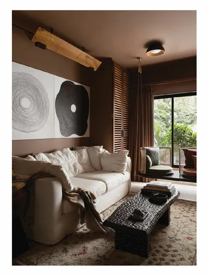 This is a glimpse into my own 850-square-foot home, a personal exploration of living with less but better. We used a warm, earthy palette, plush natural fabrics, and bold, clean-lined furniture to create a space that feels expansive, calm, and deeply personal.