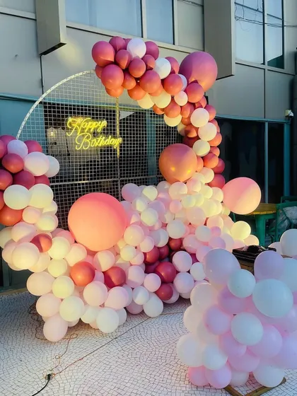 Another view of the stunning pink and white balloon installation, perfect for a birthday or anniversary celebration.