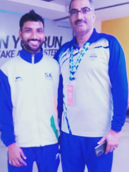 Posing with a fellow coach and official. My experience as a national medalist and my connections in the Sports Authority of India (SAI) help my athletes get the best opportunities.