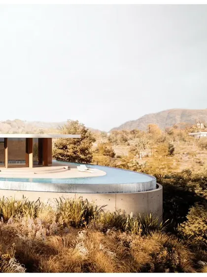 A detail of the villa's edge, where the infinity pool meets the natural landscape, creating a dramatic visual effect.