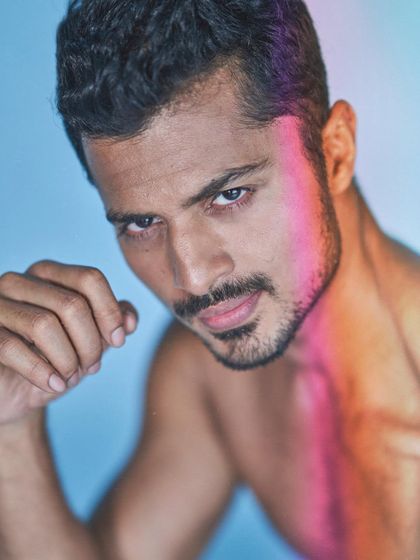 A close-up portrait with creative lighting, highlighting my features and ability to work with artistic lighting setups.