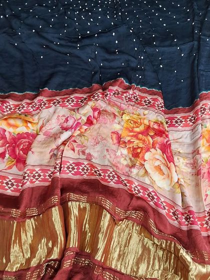 A close-up of the beautiful floral and geometric patterns on our Bandhej digital printed dupatta. The modal fabric is soft and has a lovely drape.