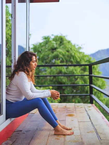 A quiet moment of reflection on the balcony of our yoga shala, overlooking the mountains. These pauses are essential for integration.