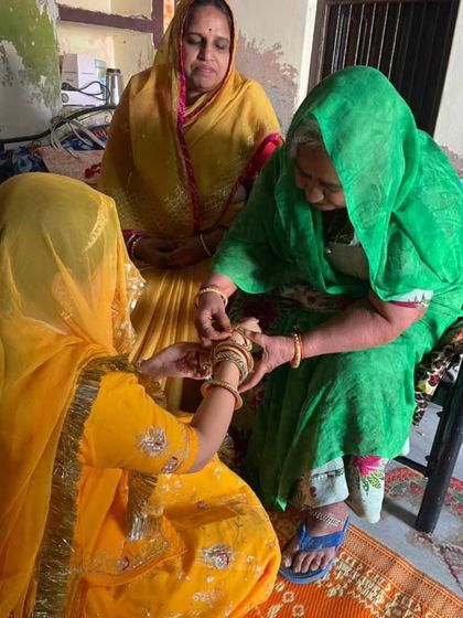 A beautiful "Bindhani" moment, as a great-grandmother-in-law admires the traditional bangles and gokhroo on her daughter-in-law's wrist. For me, jewellery is about connecting generations.
