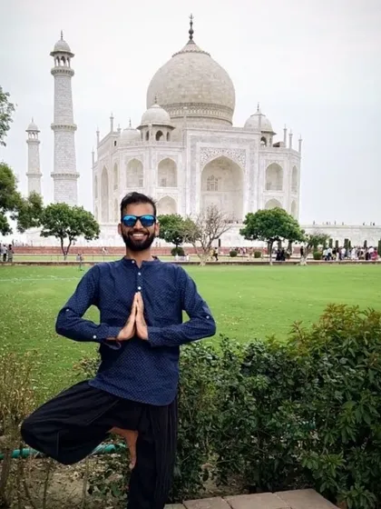 Finding balance with Vrikshasana, the tree pose, in front of the Taj Mahal. Yoga is a tool you can carry with you anywhere.