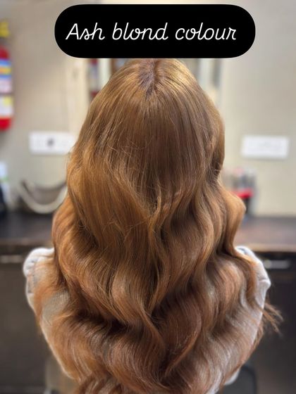 A close-up of the ash blonde color, showcasing the soft, cool tones that make this shade so sought after.