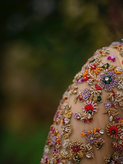 A collection of detailed shots focusing on the diverse and intricate embroidery of my custom blouses. These images highlight the fine craftsmanship, luxurious materials, and unique designs that define my work.