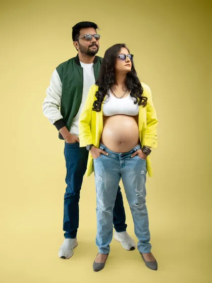 Who says maternity shoots can't be cool? This couple brought their unique style and confidence to the studio. The bold colors and confident poses reflect their partnership as they step into parenthood together.