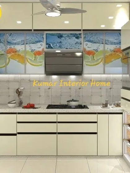 This modular kitchen features customized digital print laminate on the upper cabinets, adding a personal and vibrant touch. The design includes handleless drawers and an integrated oven unit.