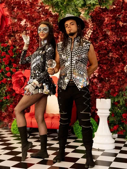 Our crystal ball act can be part of a duo performance with different themes. Here, two artists in sparkling mirrored costumes present the ball in a whimsical setting.