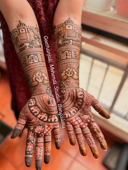 This baby shower design is as detailed as any bridal piece, with portraits of the family and symbols of new life.