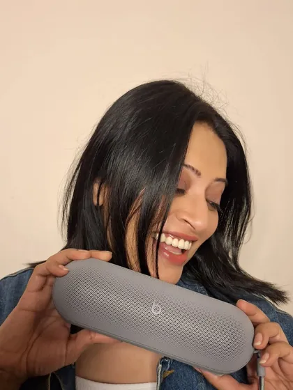 A joyful shot with the Beats Pill speaker. I love showcasing how tech products can also be stylish accessories that bring happiness.