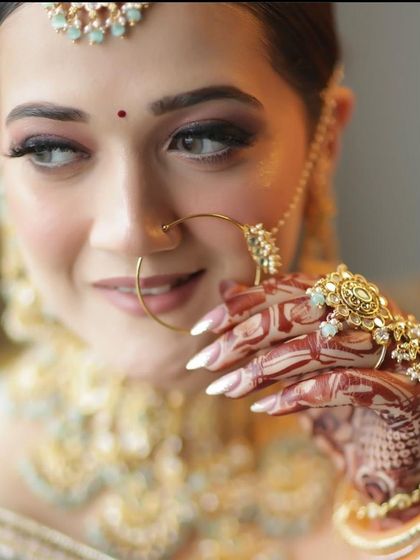 A close-up showcasing the detailed henna and nail art that complements the overall bridal look. Every detail matters for the perfect bridal presentation.
