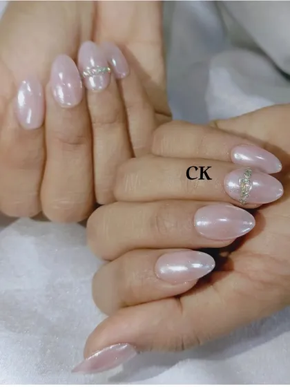 Another view of the white chrome nails, showing their high-shine, reflective surface.