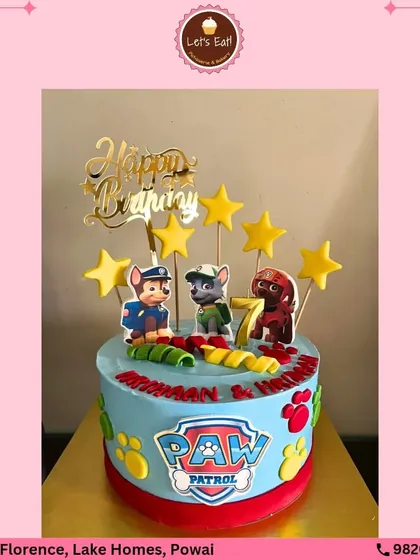 A fun and colorful Paw Patrol cake for a 7th birthday. The cake is decorated with the iconic logo and edible toppers of the heroic pups, ready to go on a rescue roll.
