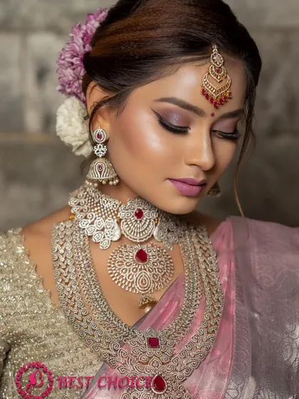 A portrait focusing on the stunning eye makeup and the way the maang tikka and necklace frame the face.